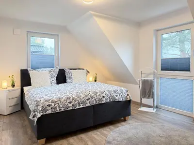 Ein Bett oder Betten in einem Zimmer der Unterkunft Boddenblick 9