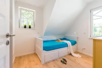 Ein Bett oder Betten in einem Zimmer der Unterkunft Bornhaus für 7 Personen