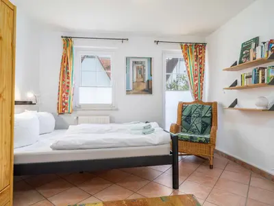 Ein Bett oder Betten in einem Zimmer der Unterkunft Abenteuer Zingst Top 4 Sterne Ferienwohnung Kormoran
