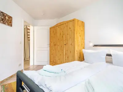 Ein Bett oder Betten in einem Zimmer der Unterkunft Abenteuer Zingst Top 4 Sterne Ferienwohnung Kormoran