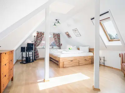 Ein Bett oder Betten in einem Zimmer der Unterkunft Abenteuer Zingst Top 4 Sterne Ferienwohnung Kormoran