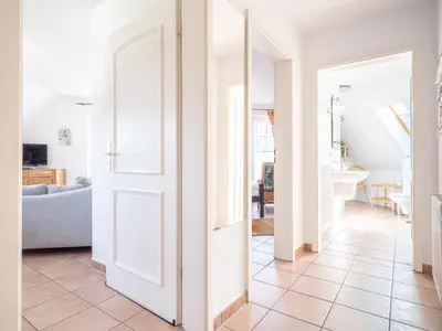 Ein Bett oder Betten in einem Zimmer der Unterkunft Abenteuer Zingst Top 4 Sterne Ferienwohnung Kormoran