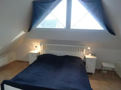 Ein Bett oder Betten in einem Zimmer der Unterkunft FW Blume