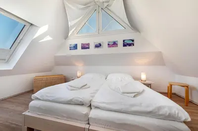 Ein Bett oder Betten in einem Zimmer der Unterkunft Godeke Michels Ferienwohnung 23-Jonggöntje Seestr5b