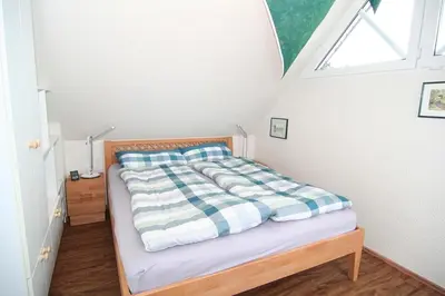 Ein Bett oder Betten in einem Zimmer der Unterkunft Windflüchter