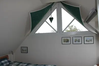Ein Bett oder Betten in einem Zimmer der Unterkunft Windflüchter