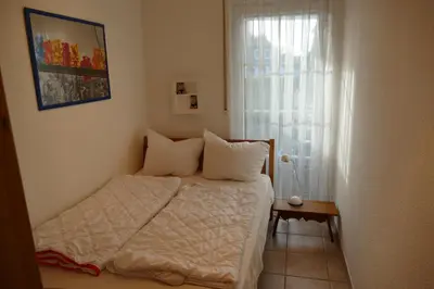 Ein Bett oder Betten in einem Zimmer der Unterkunft FeWo BrickeWE 2