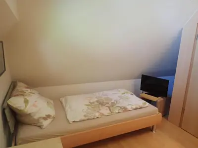 Ein Bett oder Betten in einem Zimmer der Unterkunft Ferienhaus Likedeeler Weg 13 