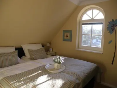 Ein Bett oder Betten in einem Zimmer der Unterkunft Ferienwohnung 3 