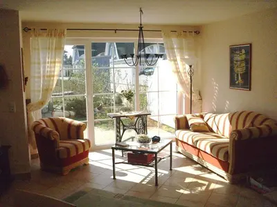 Ein Sitzbereich in der Unterkunft Ferienhaus Likedeeler Weg 23