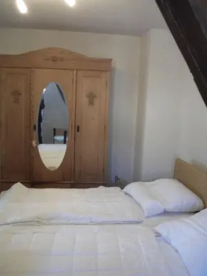 Ein Bett oder Betten in einem Zimmer der Unterkunft Ferienhaus am Fangelturm