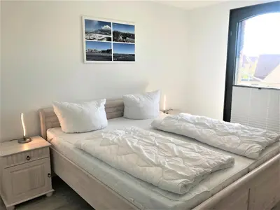 Ein Bett oder Betten in einem Zimmer der Unterkunft Ferienwohnungen in Barth am Hafen