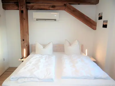 Ein Bett oder Betten in einem Zimmer der Unterkunft Ferienwohnungen in Barth am Hafen