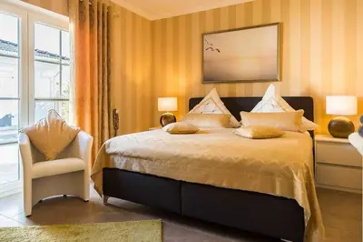 Ein Bett oder Betten in einem Zimmer der Unterkunft Haus Möwe