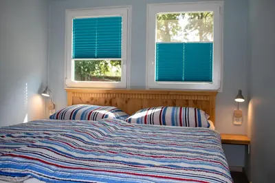 Ein Bett oder Betten in einem Zimmer der Unterkunft Ferienwohnung Bungalow Palliwoda Prerow