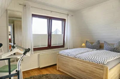 Ein Bett oder Betten in einem Zimmer der Unterkunft Mewes, Günther, FW 1 - b47900