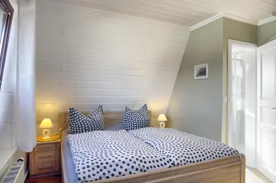 Ein Bett oder Betten in einem Zimmer der Unterkunft Mewes, Günther, FW 1 - b47900