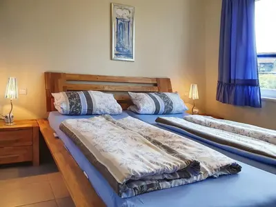 Ein Bett oder Betten in einem Zimmer der Unterkunft Darß-Fuchs