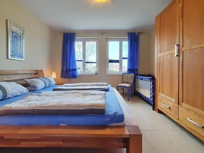 Ein Bett oder Betten in einem Zimmer der Unterkunft Darß-Fuchs