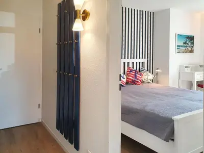 Ein Bett oder Betten in einem Zimmer der Unterkunft Darßkieker K1