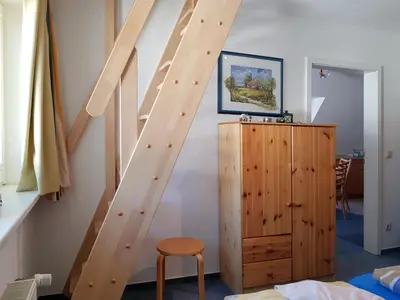 Ein Bett oder Betten in einem Zimmer der Unterkunft Das Gelbe vom Darss 7