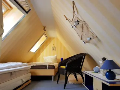 Ein Bett oder Betten in einem Zimmer der Unterkunft Das Gelbe vom Darss 7