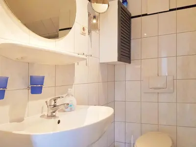 Ein Badezimmer in der Unterkunft Das Gelbe vom Darss 7