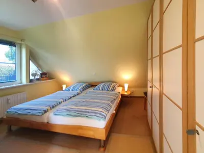 Ein Bett oder Betten in einem Zimmer der Unterkunft Das Gelbe vom Darss 8