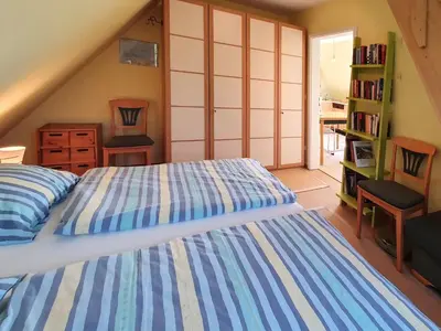 Ein Bett oder Betten in einem Zimmer der Unterkunft Das Gelbe vom Darss 8