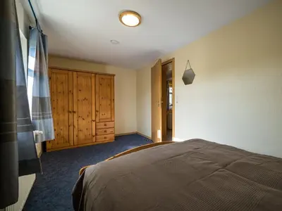 Ein Bett oder Betten in einem Zimmer der Unterkunft Hafenblick 1
