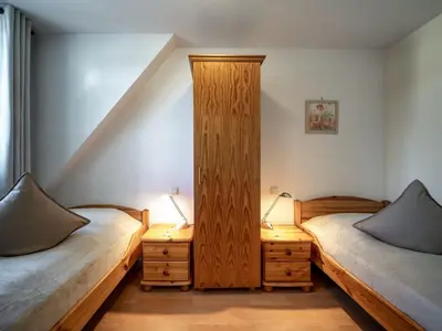Ein Bett oder Betten in einem Zimmer der Unterkunft Hafenblick 2
