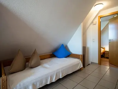 Ein Bett oder Betten in einem Zimmer der Unterkunft Hafenblick 2