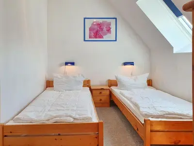 Ein Bett oder Betten in einem Zimmer der Unterkunft Romantischer Winkel Fewo 60b 4