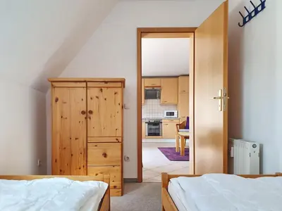 Ein Bett oder Betten in einem Zimmer der Unterkunft Romantischer Winkel Fewo 60b 4