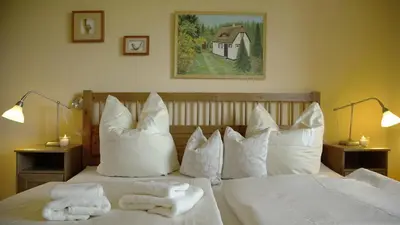 Ein Bett oder Betten in einem Zimmer der Unterkunft Wiesenblick FeWo 7