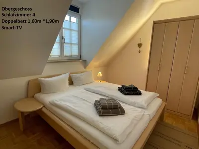 Ein Bett oder Betten in einem Zimmer der Unterkunft Haus Admiral mit Garten, 5 Gehminuten zum Strand, inklusive WLAN, Sauna, Kamin, Tischtennisplatte, Bollerwagen für den Strand