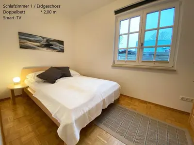 Ein Bett oder Betten in einem Zimmer der Unterkunft Haus Admiral mit Garten, 5 Gehminuten zum Strand, inklusive WLAN, Sauna, Kamin, Tischtennisplatte, Bollerwagen für den Strand