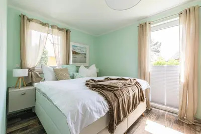 Ein Bett oder Betten in einem Zimmer der Unterkunft Ferienwohnung Cellina