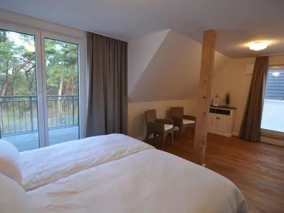 Ein Bett oder Betten in einem Zimmer der Unterkunft Holiday house dune forest b