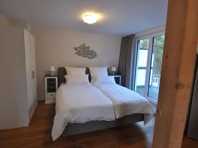 Ein Bett oder Betten in einem Zimmer der Unterkunft Holiday house dune forest b