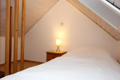 Ein Bett oder Betten in einem Zimmer der Unterkunft Bullerbü 2