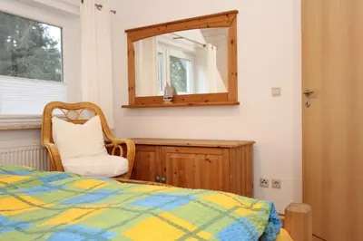 Ein Bett oder Betten in einem Zimmer der Unterkunft Bullerbü 2