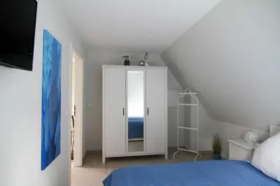 Ein Bett oder Betten in einem Zimmer der Unterkunft FeWo ZENO III