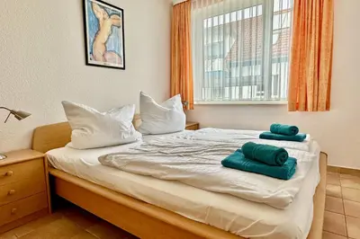 Ein Bett oder Betten in einem Zimmer der Unterkunft Residenz am Strand - 2-Raum Apartment