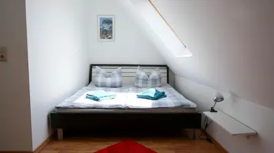 Ein Bett oder Betten in einem Zimmer der Unterkunft Dat blaue Huus - Am Tor zum Darß