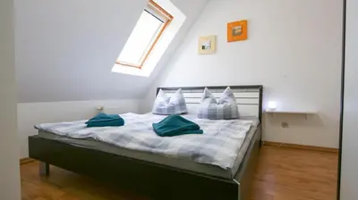 Ein Bett oder Betten in einem Zimmer der Unterkunft Dat blaue Huus - Am Tor zum Darß