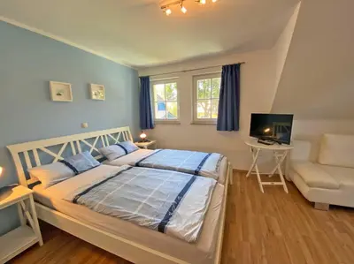 Ein Bett oder Betten in einem Zimmer der Unterkunft Seeschwälbchen - Ihr Ferienhaus am Ostseestrand