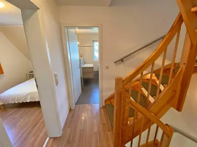 Ein Bett oder Betten in einem Zimmer der Unterkunft Seeschwälbchen - Ihr Ferienhaus am Ostseestrand