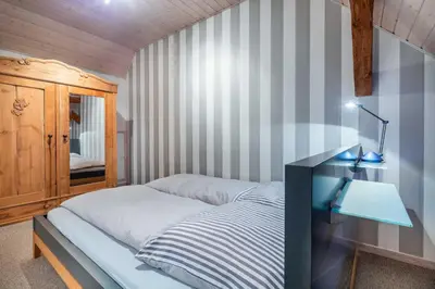 Ein Bett oder Betten in einem Zimmer der Unterkunft Ostseelandhaus mit Südterrasse und Teich OFC 07
