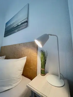 Ein Bett oder Betten in einem Zimmer der Unterkunft Ferienwohnung Meerverliebt